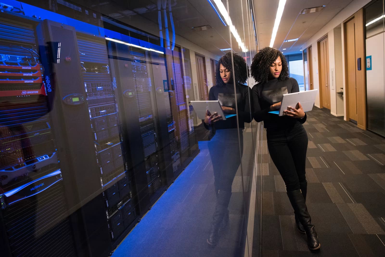 A woman in an office working on her laptop adding alt text to images